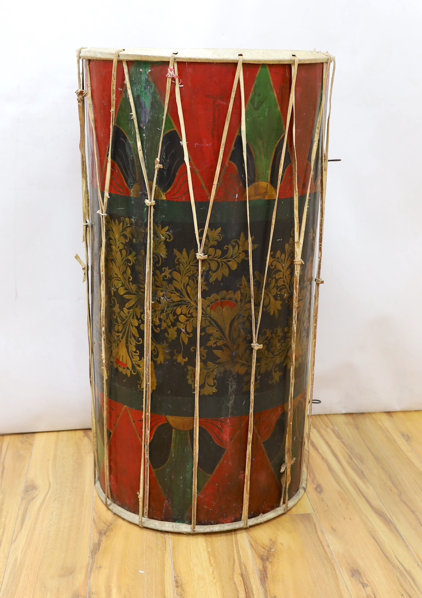 A large sub Saharan tribal drum, 96cm tall